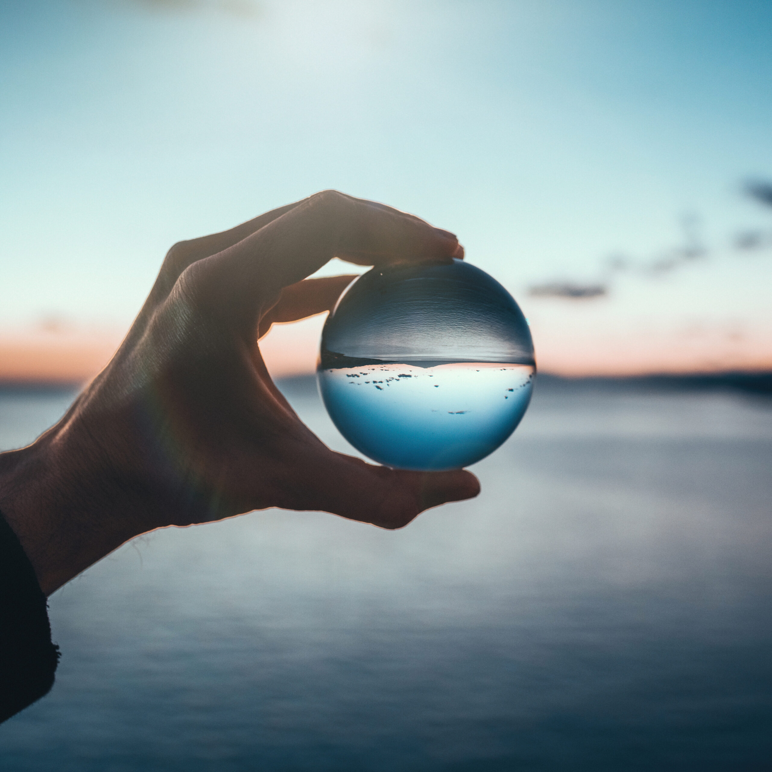 Holding-glass-ball-at-dusk-1101924